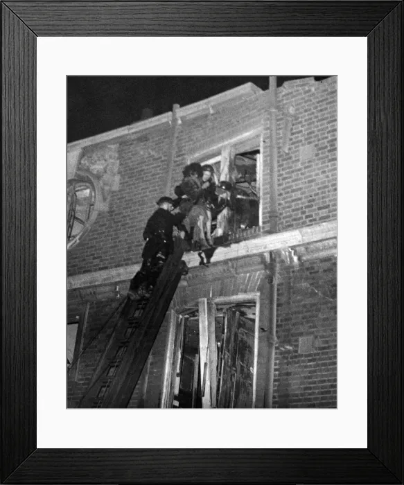 Framed Print : A woman being rescued from a block of flats damaged by a V bomb in Southern England Framed Print : A woman being rescued from a block of flats damaged by a V bomb in Southern England