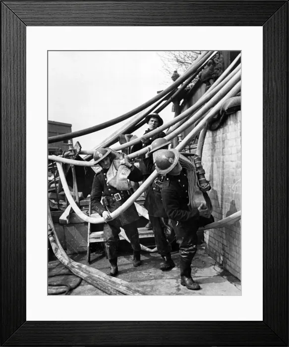 Framed Print : AFS men have to almost fight their way through a maze of pipes. 10th May 1941 Framed Print : AFS men have to almost fight their way through a maze of pipes. 10th May 1941