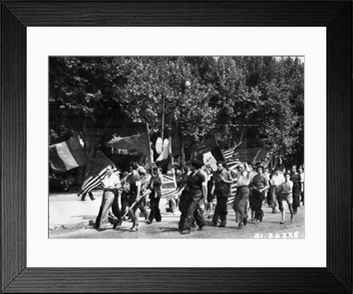 Framed Print : Partisans of Aix, in Southern France, stage a welcoming parade for liberating forces of Framed Print : Partisans of Aix, in Southern France, stage a welcoming parade for liberating forces of