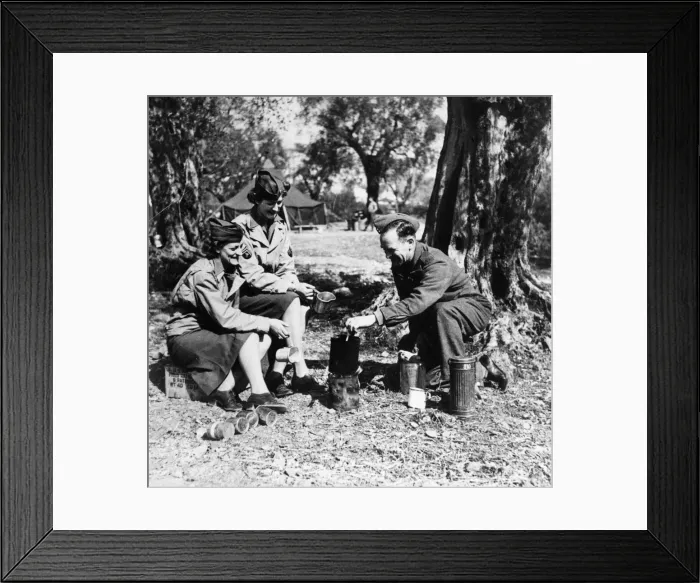 Framed Print : A British soldier enjoys a cup of tea with two women of the American Women Framed Print : A British soldier enjoys a cup of tea with two women of the American Women