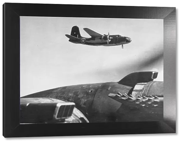 A Douglas Boston 111 in flight. (background) (serial letter F