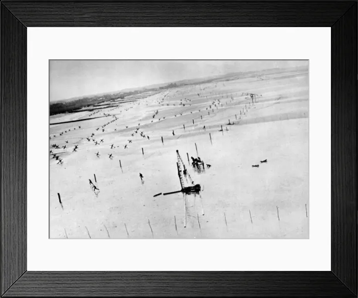 Framed Print : GERMAN TROOPS RUN FOR COVER AS ALLIED PLANE MAKES ATTACK ON BEACH OBSTACLES DURING D-DAY Framed Print : GERMAN TROOPS RUN FOR COVER AS ALLIED PLANE MAKES ATTACK ON BEACH OBSTACLES DURING D-DAY