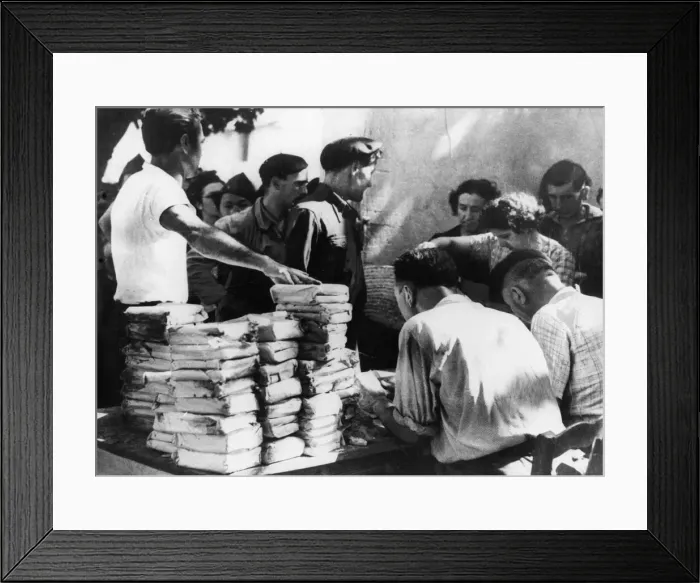 Framed Print : Rations abandoned by the retreating Germans in Southern France being distributed to Framed Print : Rations abandoned by the retreating Germans in Southern France being distributed to