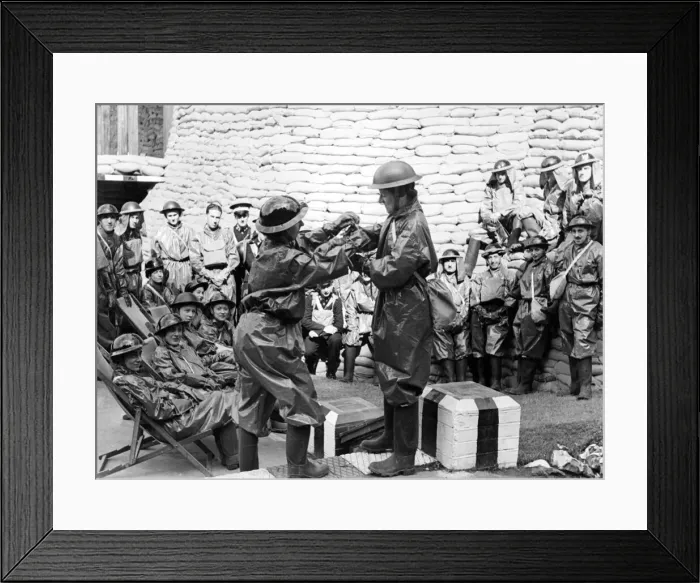 Framed Print : How to quickly dress in gas clothes. Women demonstrate at a first aid post in Hendon Framed Print : How to quickly dress in gas clothes. Women demonstrate at a first aid post in Hendon