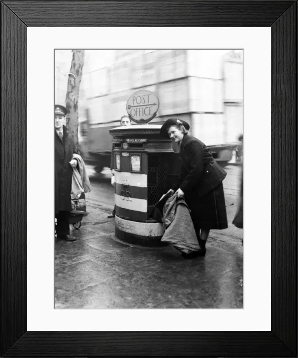Framed Print : A post girl collecting letters in a London district. 1st February 1941 Framed Print : A post girl collecting letters in a London district. 1st February 1941