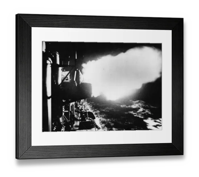Framed Print : The flash of US Navy destroyer guns light up the vessels deck