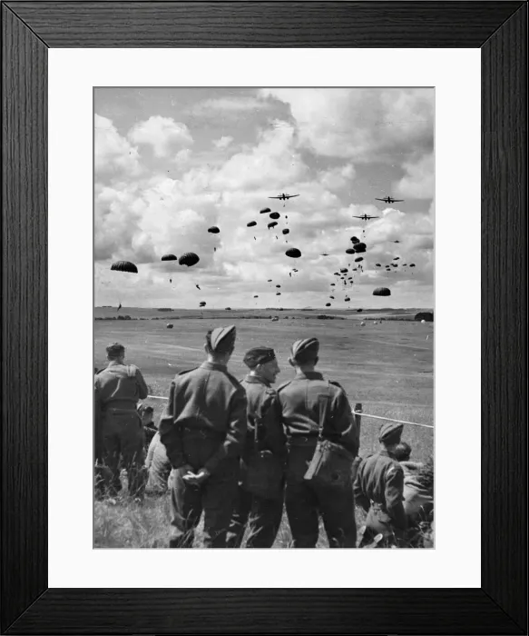 Framed Print : British army soldiers watch paratroops descending from aircraft during a demonstration in