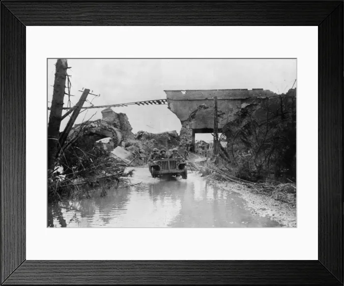 Framed Print : Cooks of an American Infantry Company splash through water in a Jeep as they return