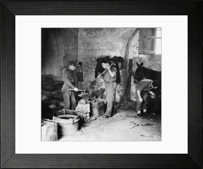 Framed Print : Private W. Day and Farrier H. Jones make horse shoes in Cassino, Italy Framed Print : Private W. Day and Farrier H. Jones make horse shoes in Cassino, Italy