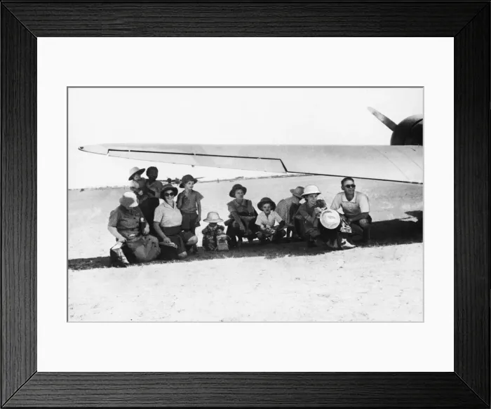 Framed Print : British civilians evacuated by RAF aircraft. Women and children shelter from the sun Framed Print : British civilians evacuated by RAF aircraft. Women and children shelter from the sun