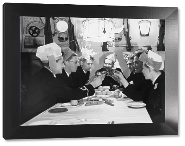 A toast to the King during a Christmas party in the ward room of HMS Westminster