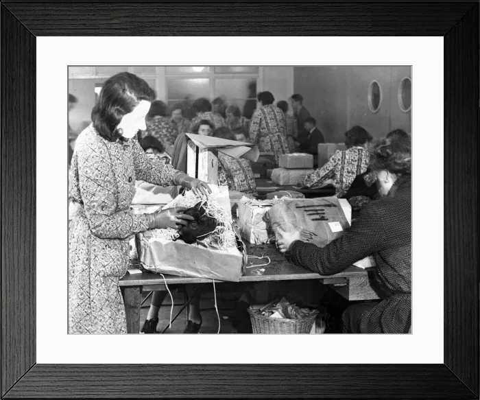 Framed Print : A woman checks for contraband in a sorting office in Aintree, Liverpool. November 1939 Framed Print : A woman checks for contraband in a sorting office in Aintree, Liverpool. November 1939