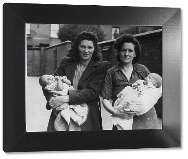 Three weeks old Raymond Ratford, the youngest evacuee, photographed with the mother