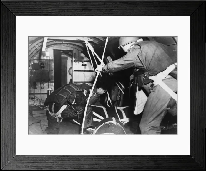 Framed Print : The jump master and crew chief push out supplies in para-packs from a transport plane for Framed Print : The jump master and crew chief push out supplies in para-packs from a transport plane for