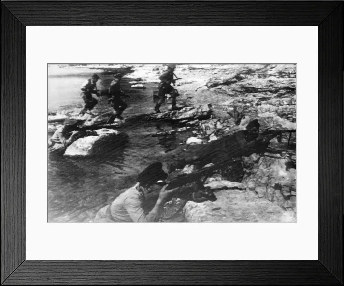 Framed Print : A group of automatic riflemen and marines of the Soviet Red Army make an assault landing Framed Print : A group of automatic riflemen and marines of the Soviet Red Army make an assault landing