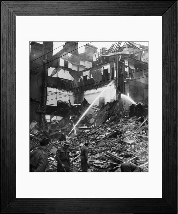 Framed Print : Firefighters attend the scene of devastation at the Valiant