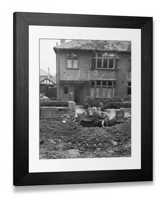 Framed Print : A house in Liverpool, Merseyside, with its windows blown out and damage to the roof