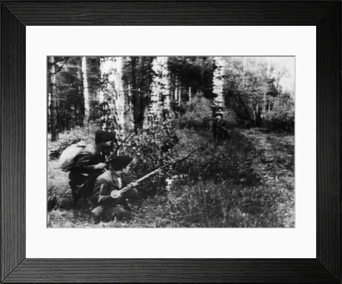 Framed Print : Soviet Guerillas lying in wait beside a track through a dense wood in the rear of Framed Print : Soviet Guerillas lying in wait beside a track through a dense wood in the rear of