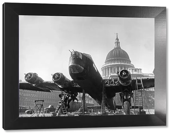 A Stirling bomber in front of St Pauls Cathedral in the City of London