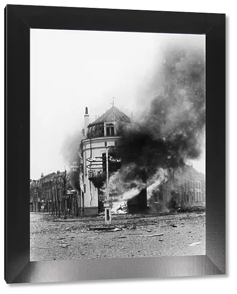 A building blazes in Armentieres after German bombing. 8th June 1940