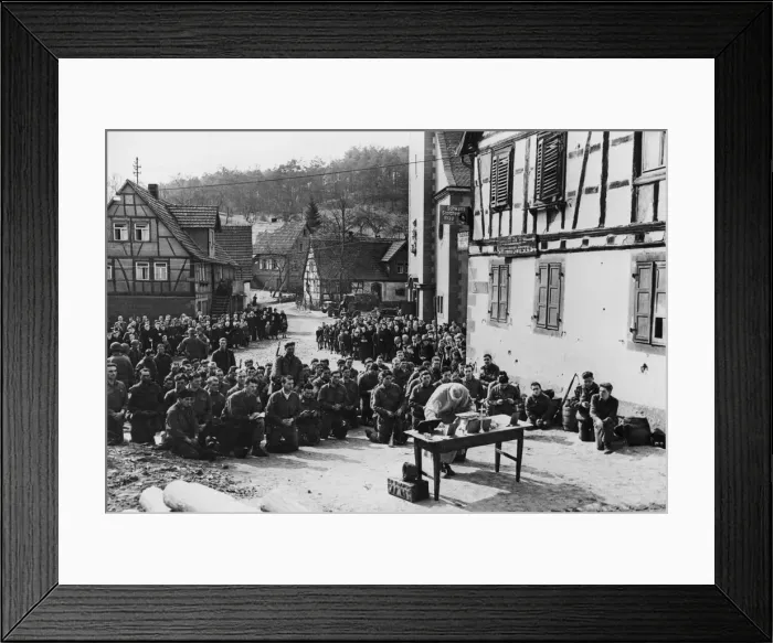Framed Print : German civilians stand and stare in awe, heads bowed as they watch Palm Sunday services