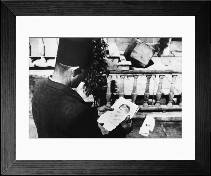 Framed Print : A Beirut citizen looks at a leaflet showing General Montgomery. 28th June 1943 Framed Print : A Beirut citizen looks at a leaflet showing General Montgomery. 28th June 1943