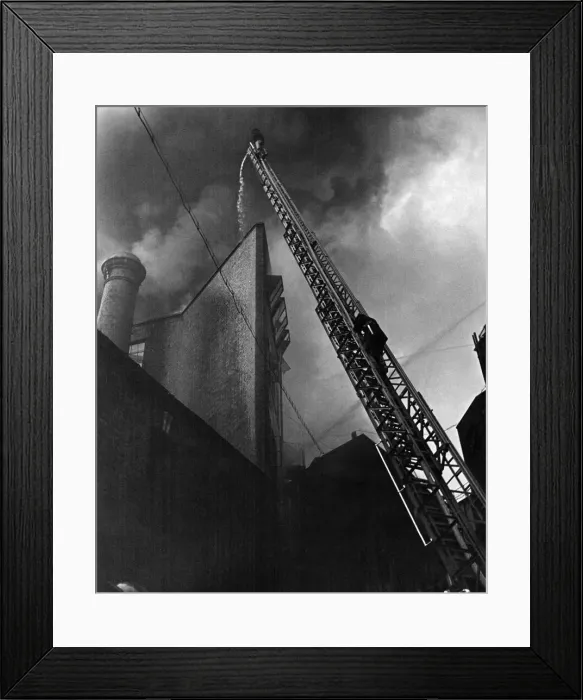Framed Print : Scene from the London areas biggest yet buzz bomb fire when a warehouse Framed Print : Scene from the London areas biggest yet buzz bomb fire when a warehouse