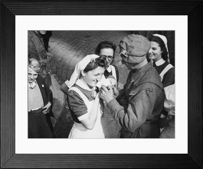 Framed Print : A British soldier autographs the cap of a Dutch nurse at Eindhoven as a souvenir of Framed Print : A British soldier autographs the cap of a Dutch nurse at Eindhoven as a souvenir of
