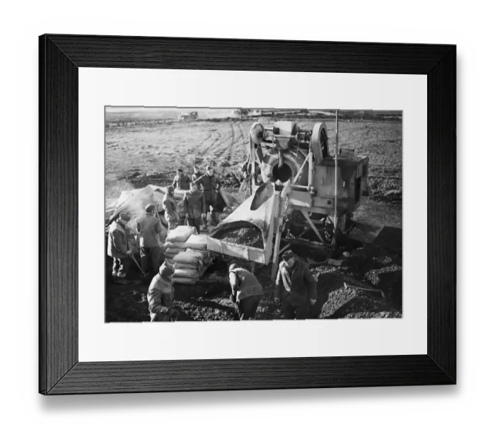 Framed Print : R. A. F. workers mix concrete during Second World War. 28th February 1944