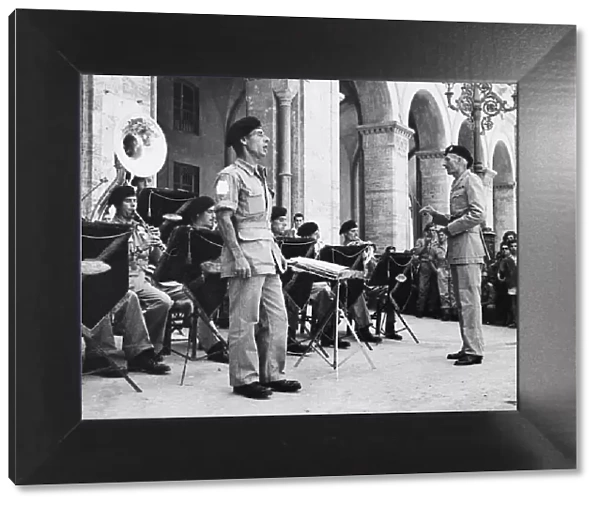Trumpet Major Joseph Allen entertains locals in Perugia. 15th July 1944