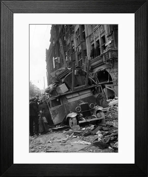 Framed Print : A van being loaded with furniture moving items from a bombed building is covered by Framed Print : A van being loaded with furniture moving items from a bombed building is covered by