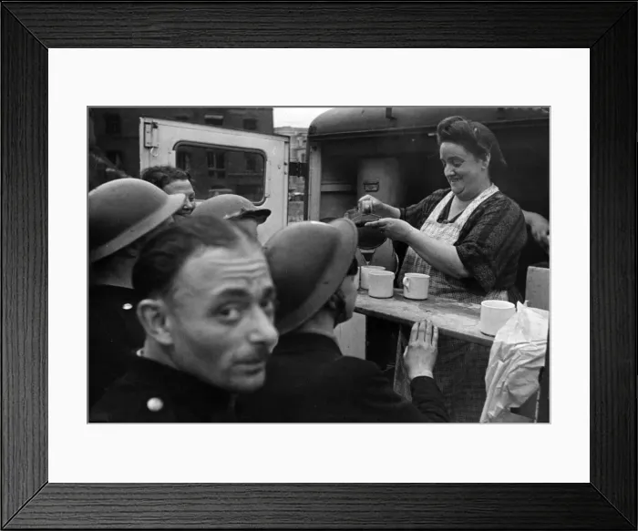 Framed Print : A cheery face behind a cup of tea - well earned refreshment for scores of soldiers Framed Print : A cheery face behind a cup of tea - well earned refreshment for scores of soldiers