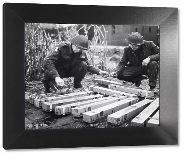 Sappers of the 51st Highland Division make safe these anti-personnel mines removed