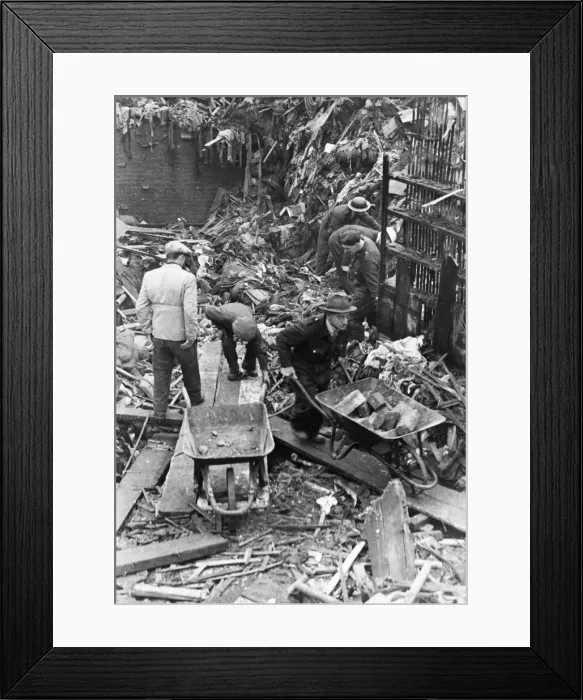 Framed Print : Civilians and firemen help to clear wreckage after another World War Two air raid over Framed Print : Civilians and firemen help to clear wreckage after another World War Two air raid over