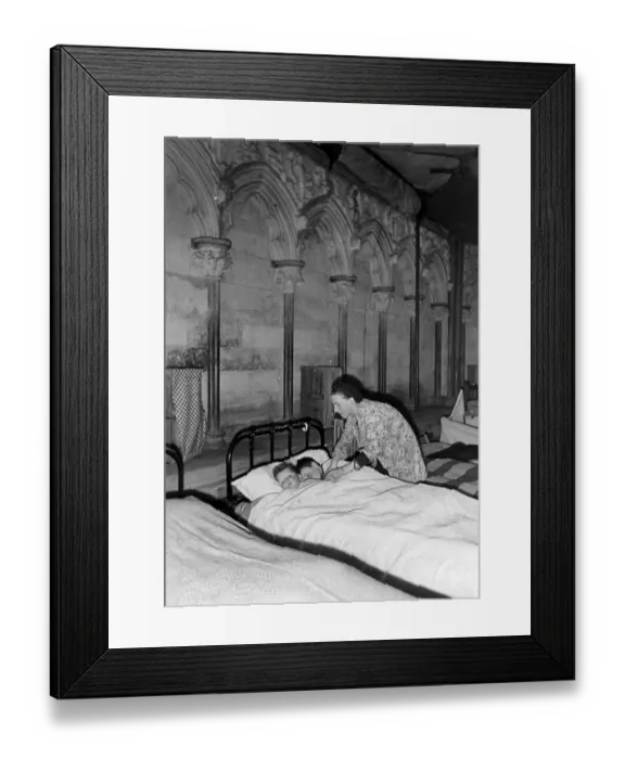 Framed Print : A woman tucking two children into bed, Salisbury Cathedral