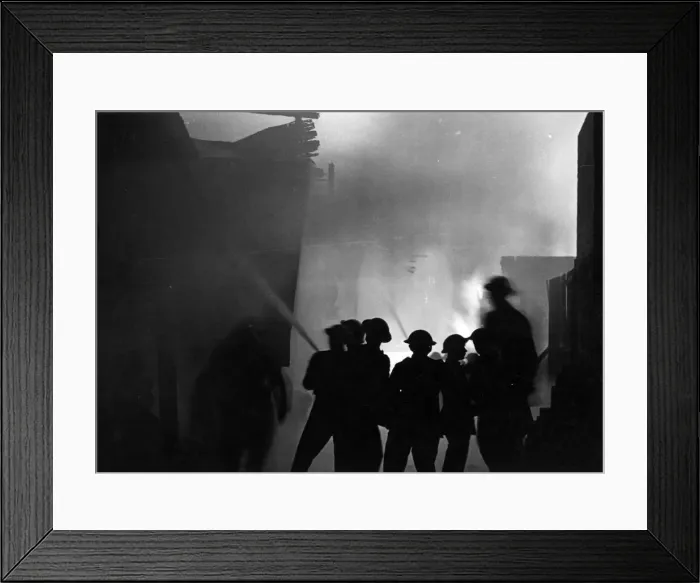 Framed Print : During a recent air raid incendiary bombs fell in London causing some fires which were Framed Print : During a recent air raid incendiary bombs fell in London causing some fires which were