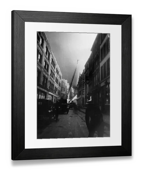 Framed Print : Firemen in the London area on top of their job. They soon quelled this fire