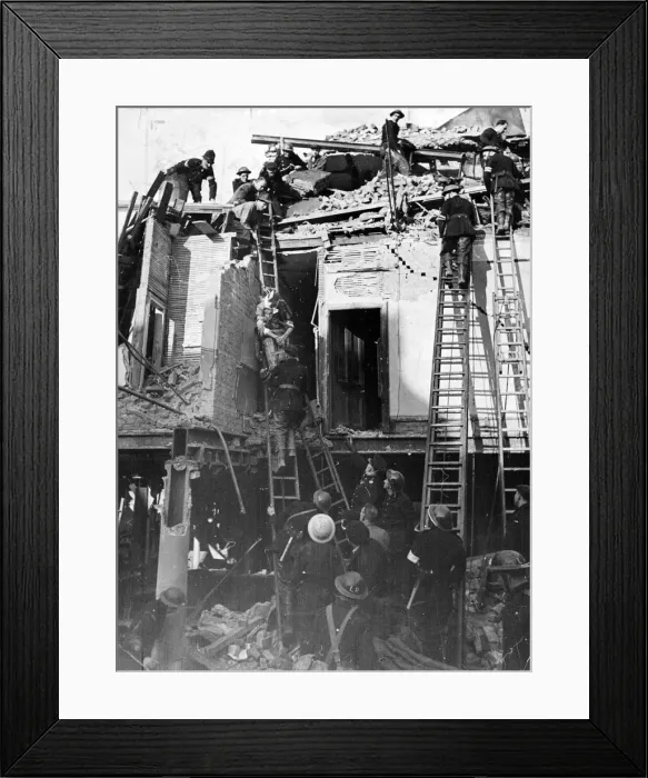 Framed Print : A V. Bomb fell on a building in South England. A man who was trapped under debris Framed Print : A V. Bomb fell on a building in South England. A man who was trapped under debris