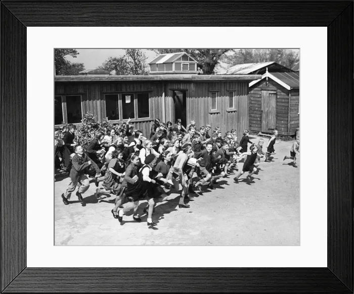 Framed Print : Children at school on the South East Coast of England, rush to their school shelter Framed Print : Children at school on the South East Coast of England, rush to their school shelter