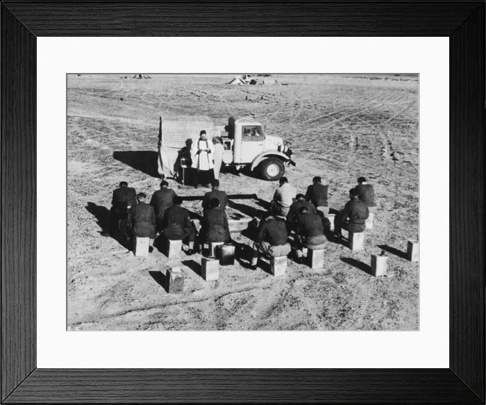 Framed Print : Indians attend Holy Communion in the desert. A Padre holding Communion at an Indian