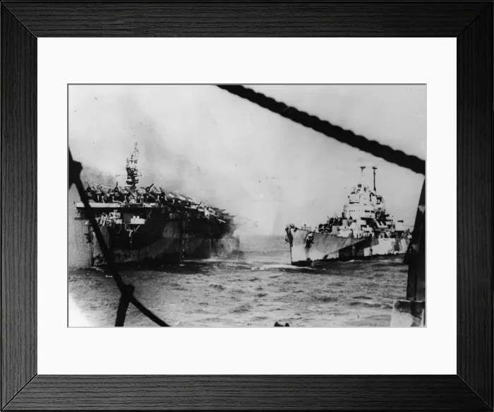 Framed Print : An American Pacific Fleet cruiser pours steams of water into the stricken light aircraft