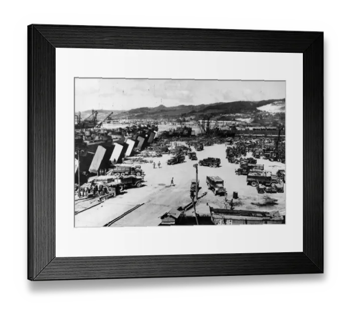 Framed Print : US trucks haul supplies to waiting LSTs (landing ship tanks