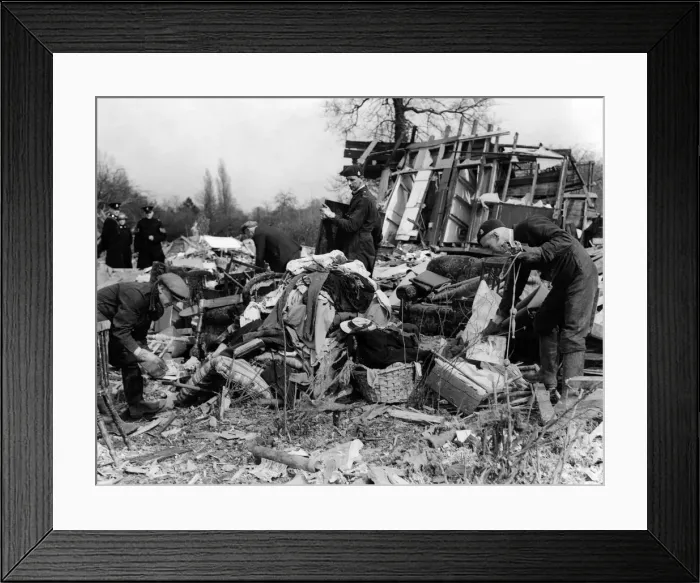 Framed Print : Death comes to evacuees living in army huts in a field. ARP rescue squads salvaging kids