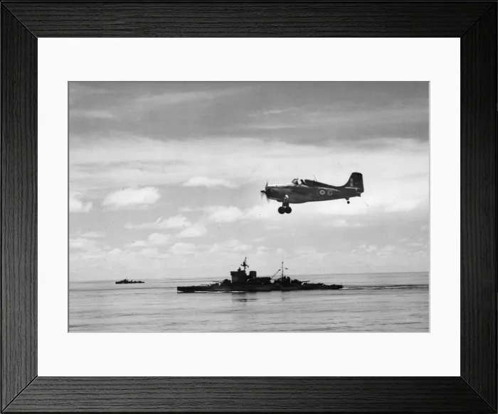 Framed Print : A Grumman-Martlett of the Royal Navy Fleet Air Arm flying over the battleship HMS Framed Print : A Grumman-Martlett of the Royal Navy Fleet Air Arm flying over the battleship HMS