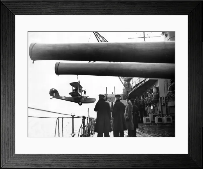 Framed Print : A Walrus aircraft returning from patrol is picked up and hoisted aboard battleship HMS Framed Print : A Walrus aircraft returning from patrol is picked up and hoisted aboard battleship HMS