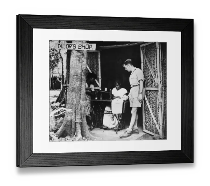Framed Print : While-U-Waits the tailors shop at an R. A. F. station in Ceylon. 17th May 1943