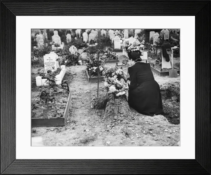 Framed Print : A lady at a graveside of a child who died during an air raid Framed Print : A lady at a graveside of a child who died during an air raid