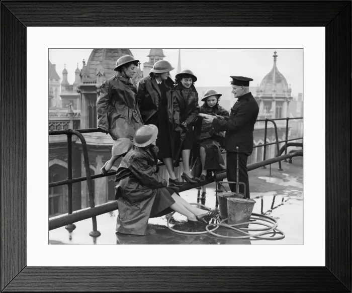 Framed Print : Explaining the composition of an incendiary bomb to office girls of a city company who Framed Print : Explaining the composition of an incendiary bomb to office girls of a city company who