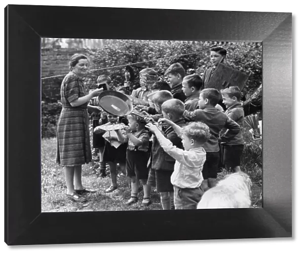 Evacuated children in St Ives present Miss Hunt with gifts on her birthday during