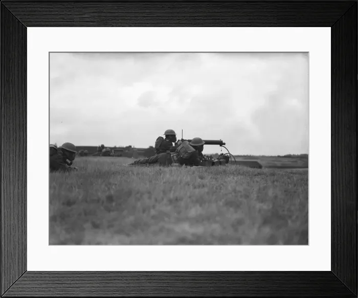 Framed Print : Army training. Soldiers training with a machine gun. Location unknown